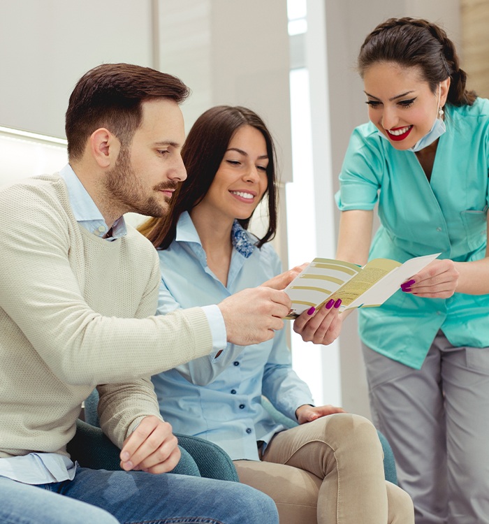 Patient reviewing dental insurance forms