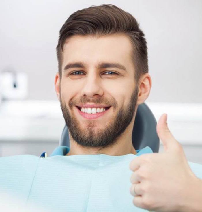 Closeup of man smiling while sitting in treatment chair