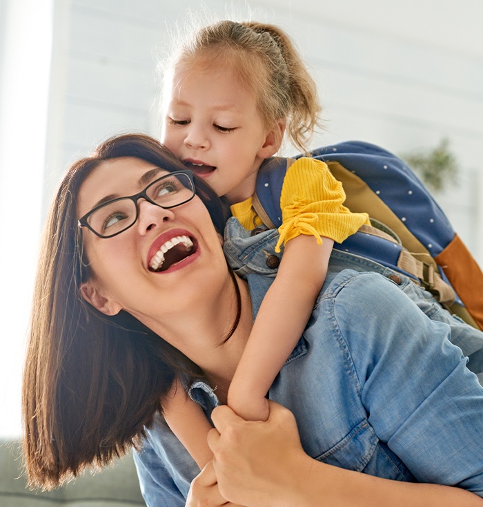 Woman and daughter smiling