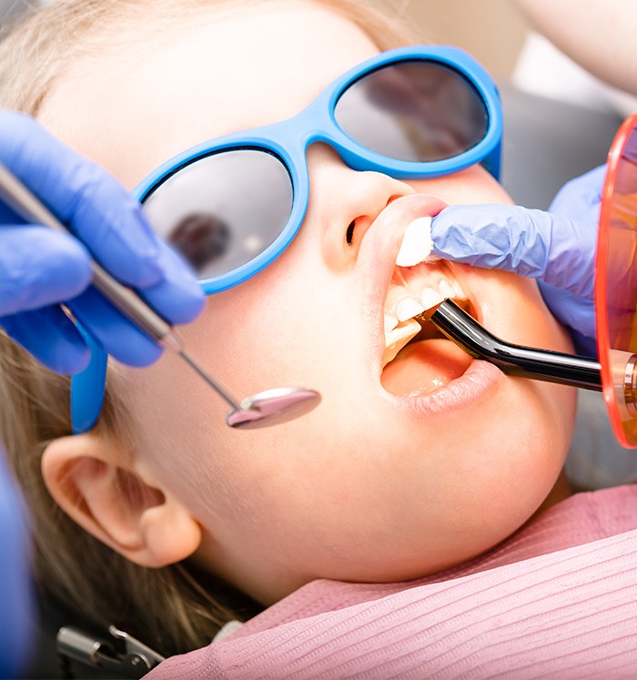 Child receiving dental treatment