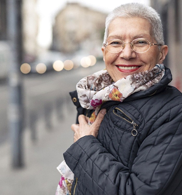 Woman in black coat smiling