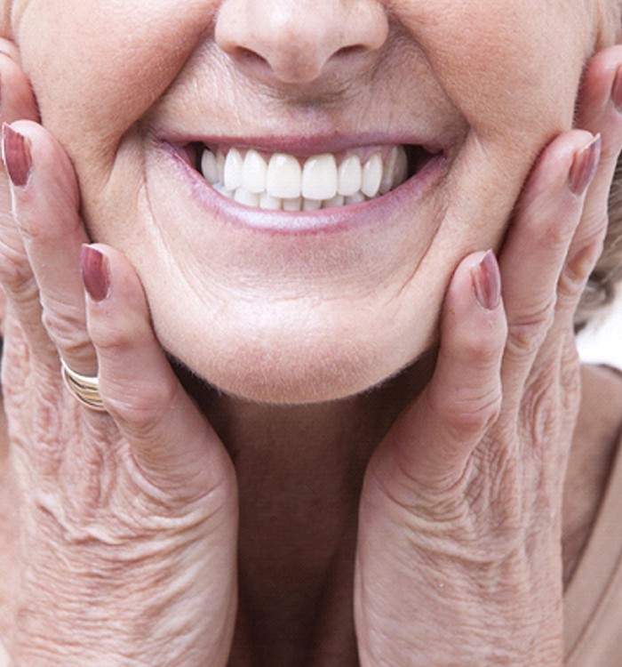 Closeup of woman smiling with dentures in Trumbull