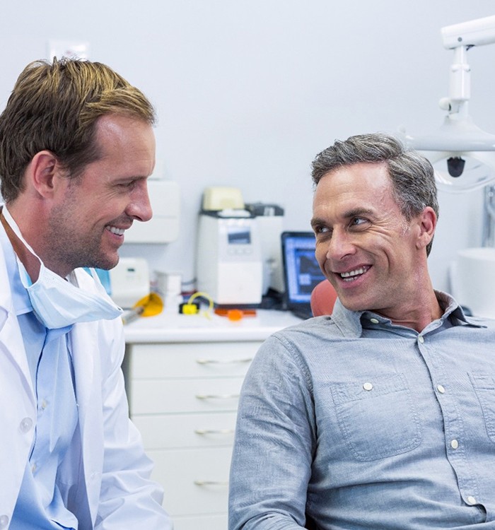 dentist talking to male patient