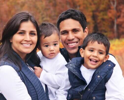 Smiling family of four