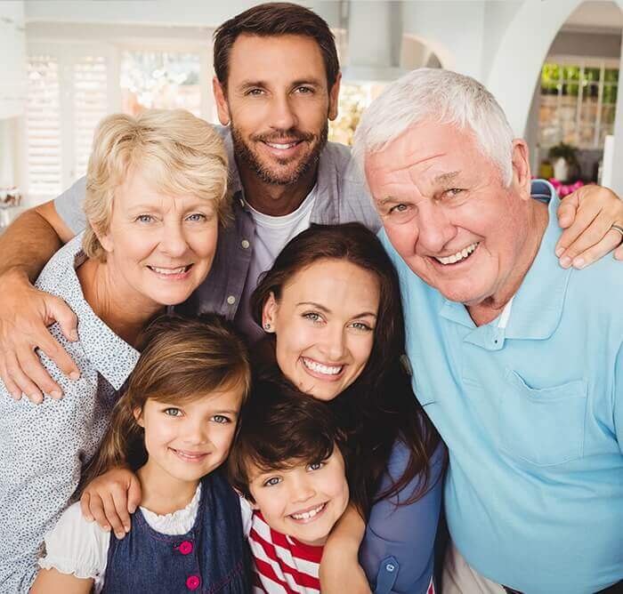 Three generations of family sharing healthy smile