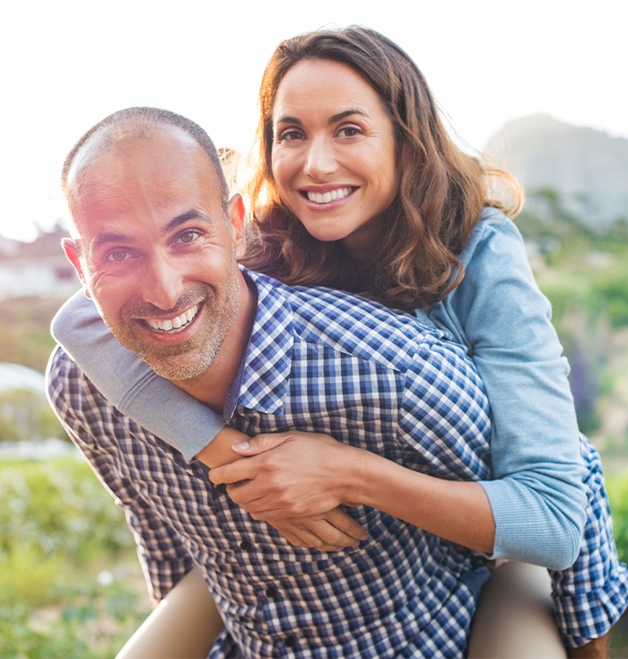 Man and woman smiling