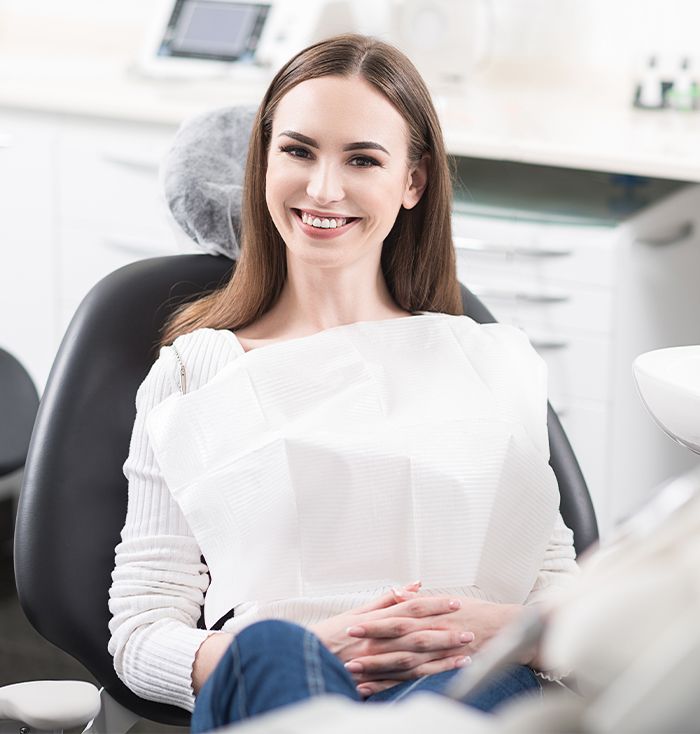 Smiling woman in dental chair