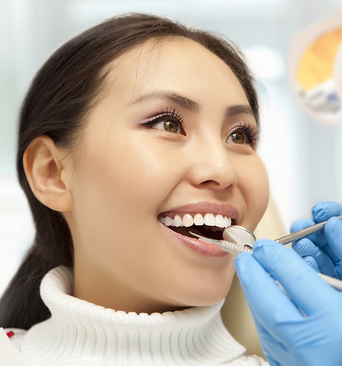 Woman receiving dental checkup