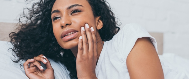 Woman holding jaw