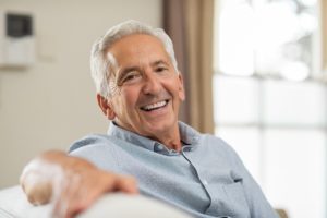 Smiling senior man with dental implants in Trumbull