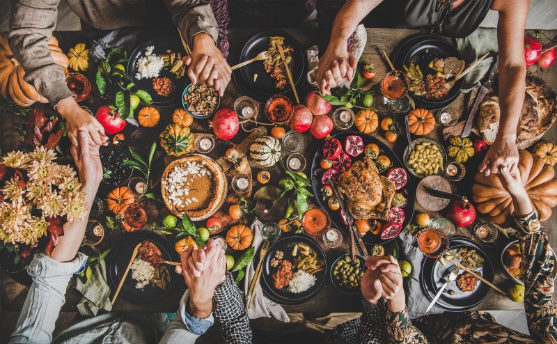 A family enjoying a holiday spread with their dental health in mind